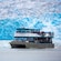 Passengers in a double deck catamaran viewing a glacier